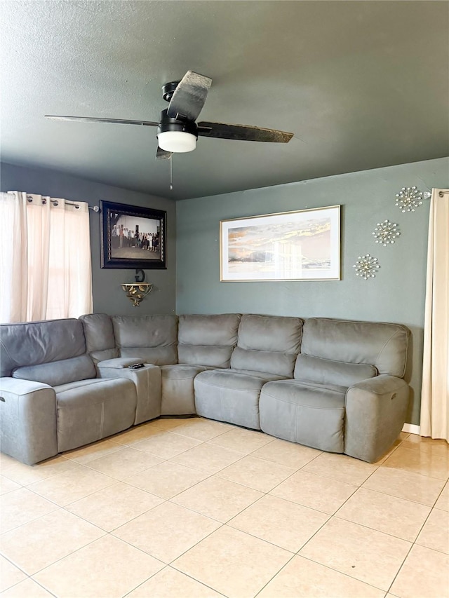 tiled living room featuring a textured ceiling and ceiling fan