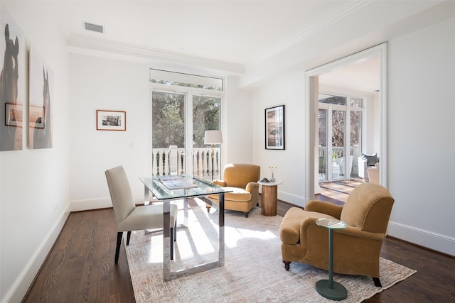 interior space featuring ornamental molding and dark wood-type flooring