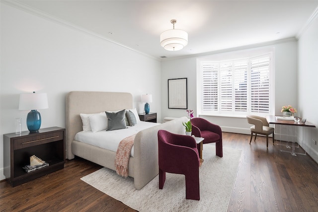 bedroom with dark hardwood / wood-style floors and crown molding