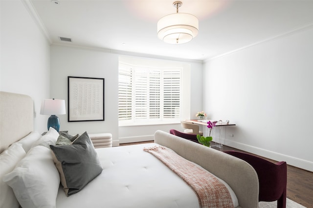 bedroom featuring wood-type flooring and ornamental molding