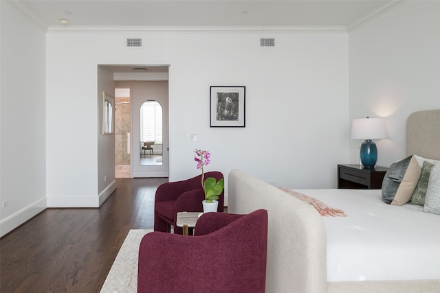 bedroom with dark wood-type flooring and crown molding