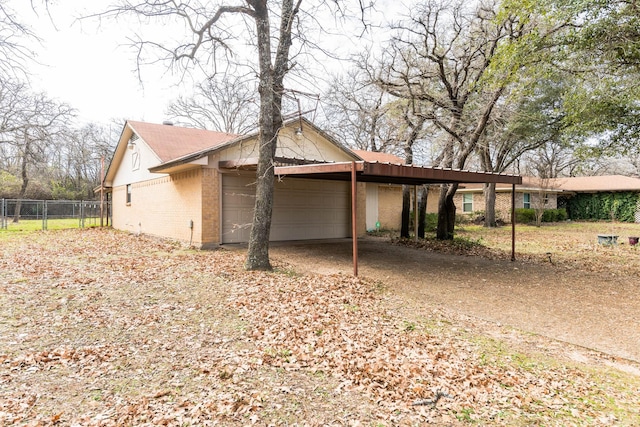 view of side of property featuring a carport