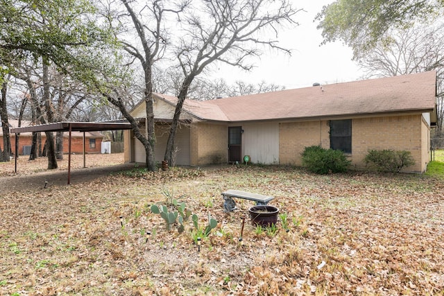 rear view of house with a carport