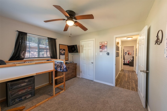 carpeted bedroom featuring ceiling fan