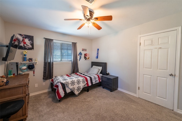 carpeted bedroom with ceiling fan