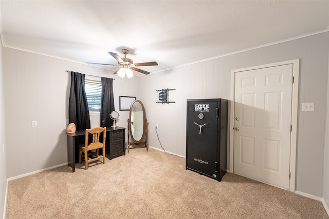 carpeted office with ceiling fan and ornamental molding