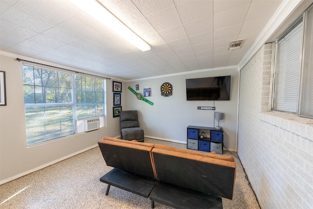 office space featuring cooling unit, crown molding, and a wealth of natural light