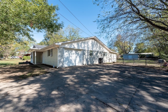 view of property exterior featuring a garage