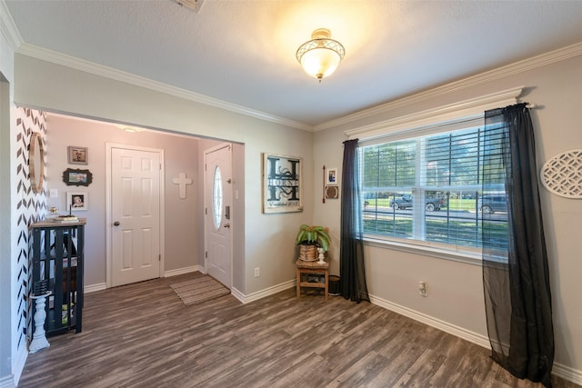 entrance foyer with dark hardwood / wood-style floors and crown molding