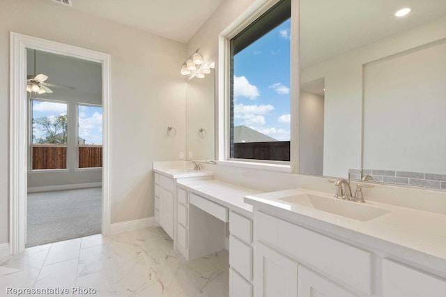 bathroom featuring vanity and ceiling fan