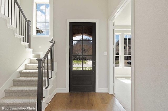 foyer featuring hardwood / wood-style floors and a wealth of natural light