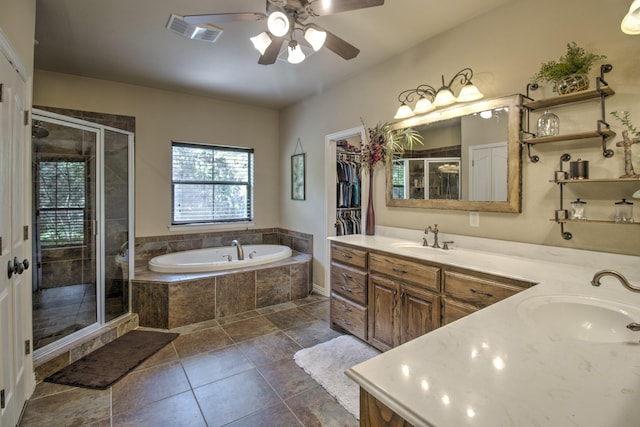 bathroom with independent shower and bath, ceiling fan, and vanity