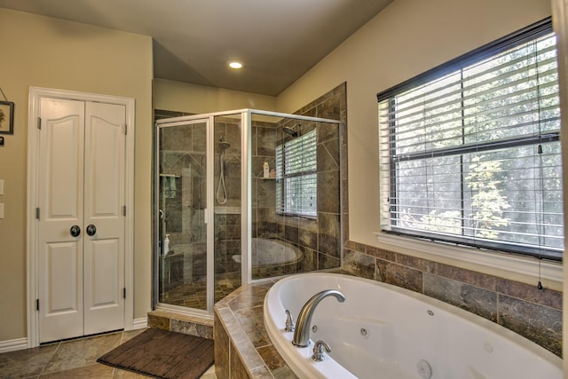 bathroom with tile patterned floors and plus walk in shower