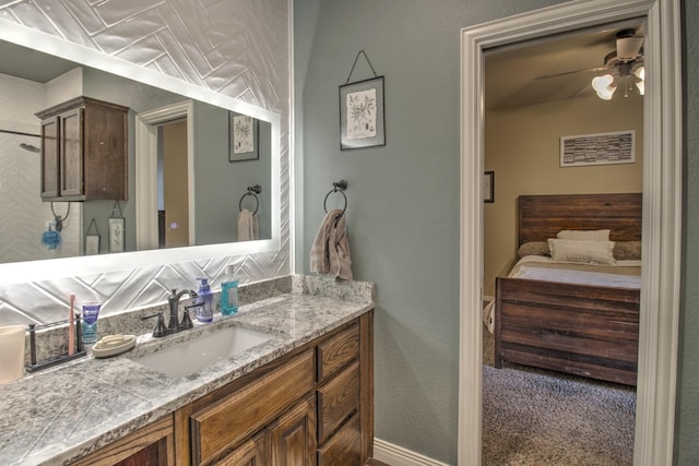 bathroom featuring ceiling fan and vanity