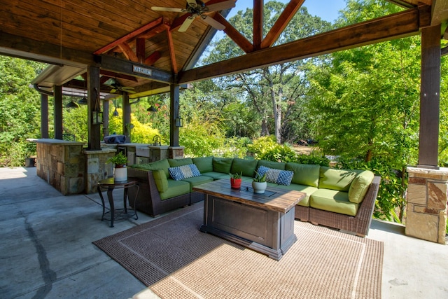 view of patio featuring ceiling fan, outdoor lounge area, a gazebo, and area for grilling