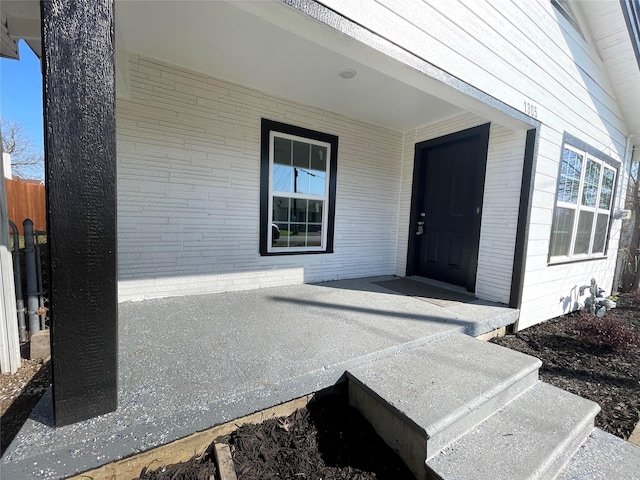 doorway to property featuring covered porch