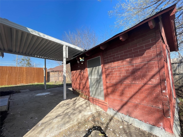 exterior space featuring a carport