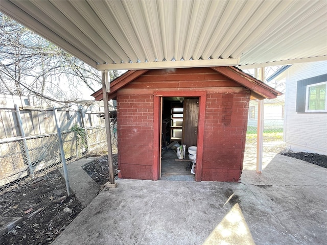 view of patio with a storage unit