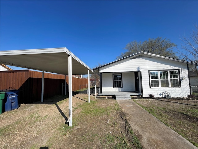 view of front of house featuring a porch and a carport