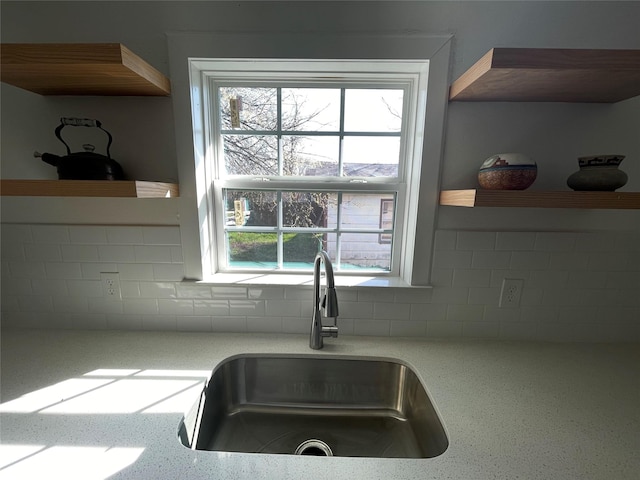 interior details with backsplash and sink