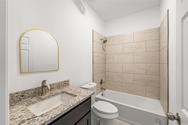 full bathroom featuring vanity, tiled shower / bath combo, and toilet