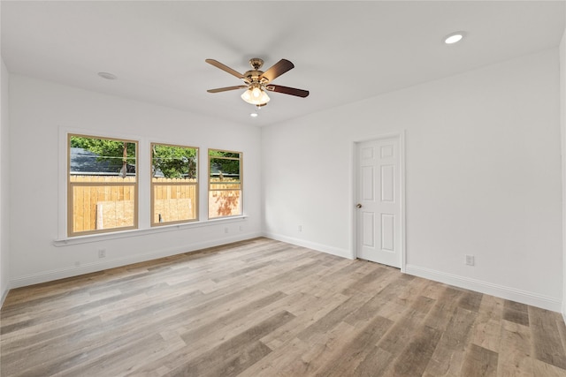 spare room with ceiling fan and light hardwood / wood-style floors