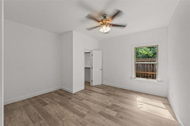 unfurnished bedroom featuring light hardwood / wood-style flooring and ceiling fan