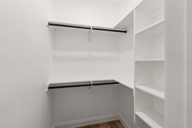 walk in closet featuring dark hardwood / wood-style floors