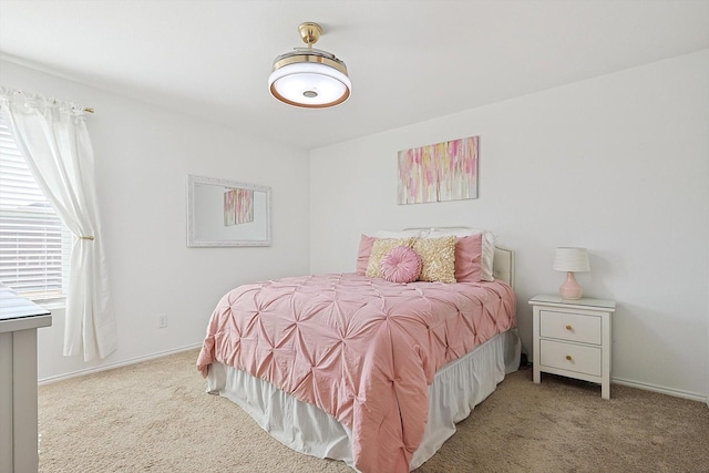 bedroom with light colored carpet