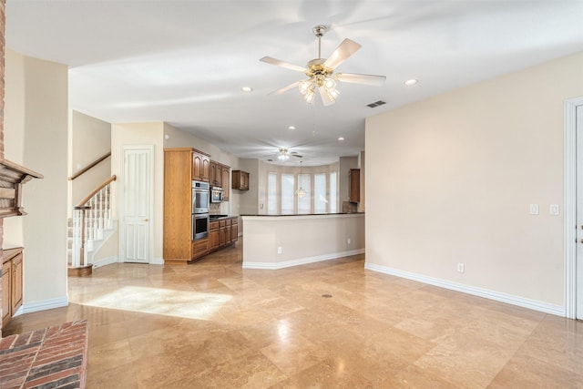 unfurnished living room featuring ceiling fan