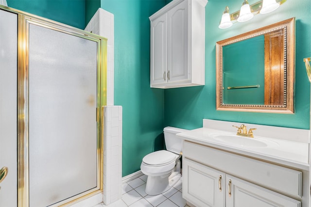 bathroom featuring toilet, tile patterned flooring, a shower with shower door, and vanity