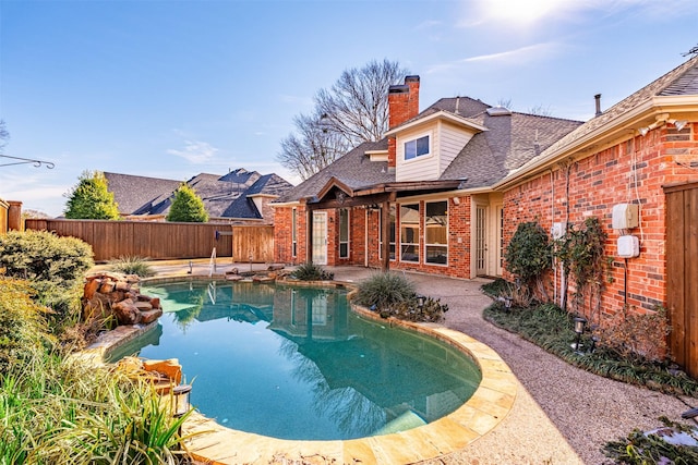 view of swimming pool featuring a patio area