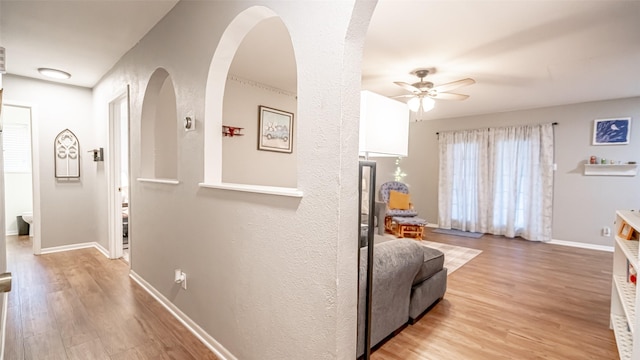 interior space with light hardwood / wood-style floors and ceiling fan