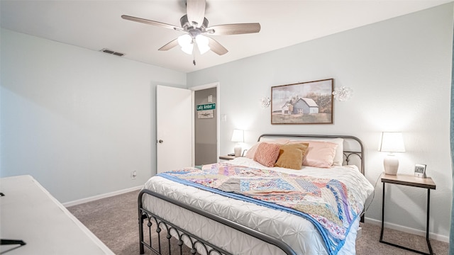 bedroom with ceiling fan and carpet