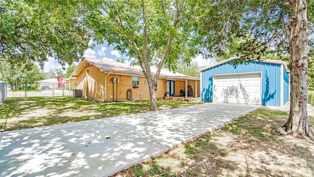 ranch-style house featuring a garage and a front lawn