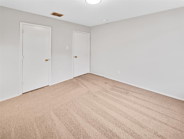 unfurnished bedroom with carpet flooring and a closet