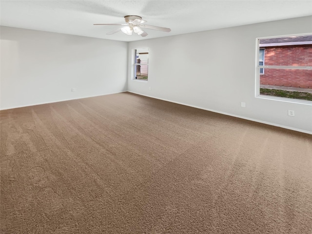 carpeted empty room with ceiling fan