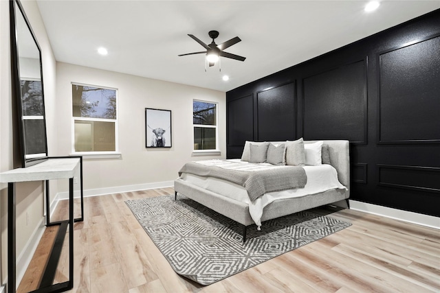 bedroom featuring light hardwood / wood-style floors and ceiling fan