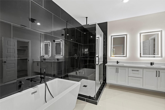 bathroom featuring vanity, shower with separate bathtub, and tile patterned flooring