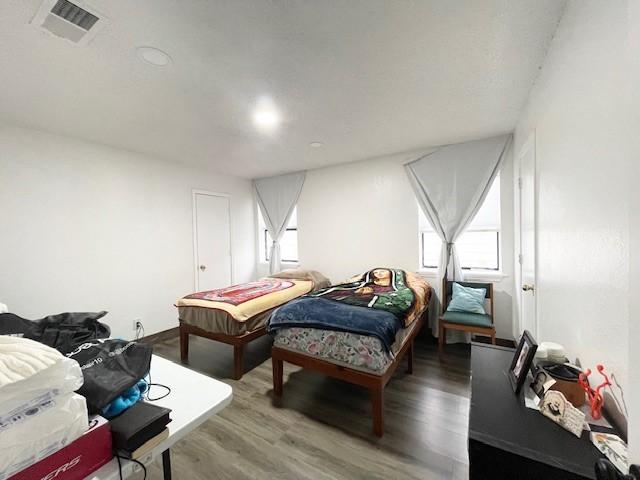 bedroom with hardwood / wood-style flooring