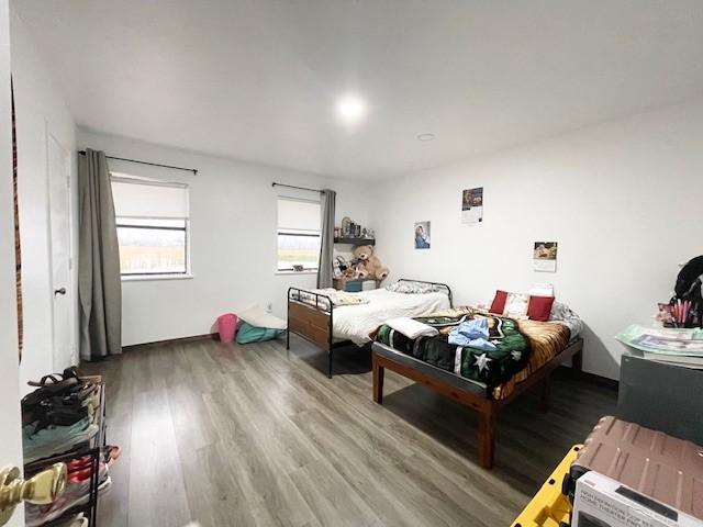 bedroom featuring hardwood / wood-style flooring