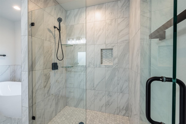 bathroom with shower with separate bathtub