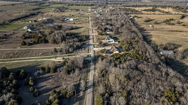 birds eye view of property featuring a rural view