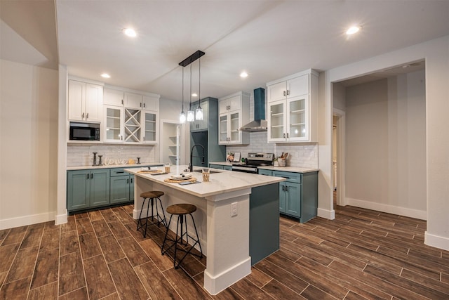 kitchen with black microwave, sink, wall chimney exhaust hood, white cabinetry, and stainless steel electric stove