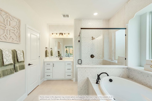 bathroom with vanity, tile patterned floors, and independent shower and bath