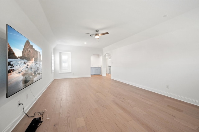 unfurnished living room featuring light hardwood / wood-style floors and ceiling fan