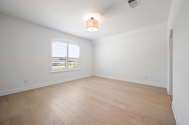 empty room with light hardwood / wood-style floors