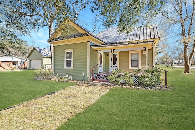 view of front of house with a garage, a porch, and a front yard