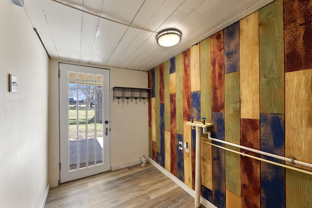 entryway with wood-type flooring and wood ceiling