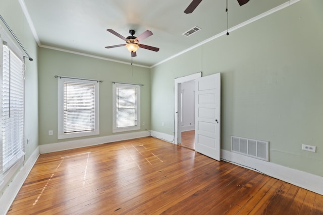 unfurnished room with ceiling fan, crown molding, and hardwood / wood-style flooring